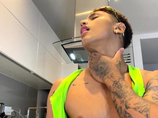Slim tattooed boy gets a handjob to his big dick